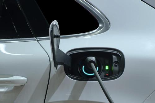 a electric car with a charging cord plugged into it at Kyriad Crepy En Valois in Crépy-en-Valois