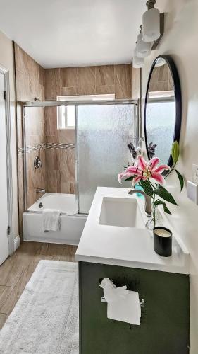 a bathroom with a sink and a bath tub at Studio Mins to LAX , Venice Beach & Sony Studios CC B in Los Angeles