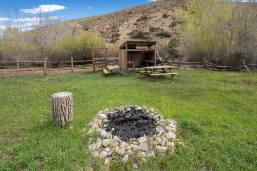 a fire pit in the middle of a field at Thousand Trails Blue Mesa Recreational Ranch in Hierro