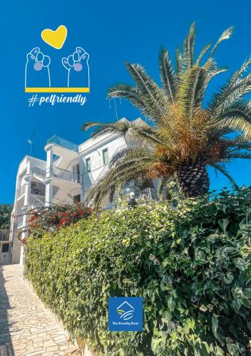 a palm tree in front of a building at The Family Nest - Casa Eva in Manfredonia