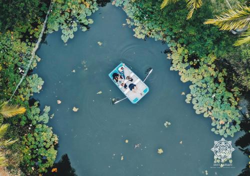 an aerial view of a boat in the water at Inti Kamari Wellness Lodge & Convention Center in Santa Isabel