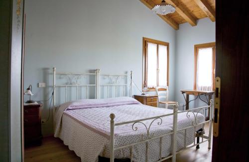 Łóżko lub łóżka w pokoju w obiekcie Agriturismo Maliso