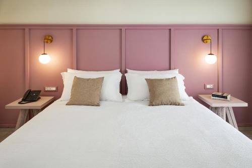 Een bed of bedden in een kamer bij Palazzo Matà Boutique Hotel