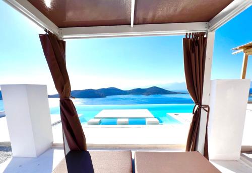 a view from a room with a view of the ocean at New Serenity Art Villa Elounda in Elounda