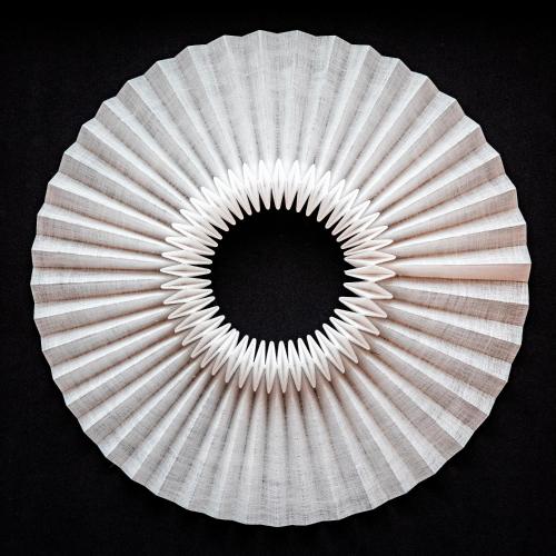 a white paper plate with a hole in the middle at Domaine de la Reine Margot Paris-Issy - MGallery Collection in Issy-les-Moulineaux