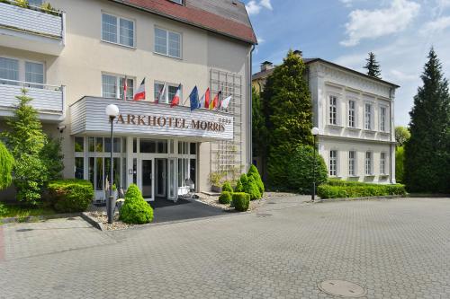 a building with a sign on the front of it at Parkhotel Morris Novy Bor in Nový Bor