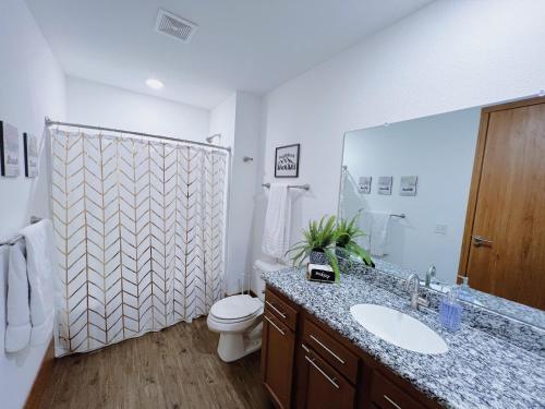 A bathroom at 2BR Suite at The Grand Castle Pool Gym & Parking