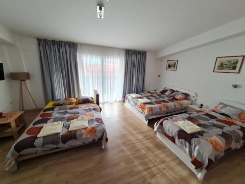 a bedroom with three beds in a room at Ohrid Sunlight in Ohrid