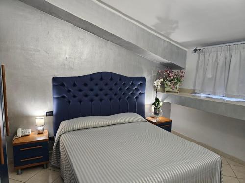 Postel nebo postele na pokoji v ubytování Hotel Il Gioiello