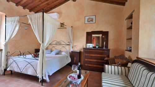 Ένα ή περισσότερα κρεβάτια σε δωμάτιο στο Sangiovese all'Aia