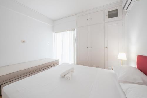 Postel nebo postele na pokoji v ubytování Athens Del Sol Suite