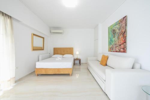 Postel nebo postele na pokoji v ubytování Athens Del Sol Suite