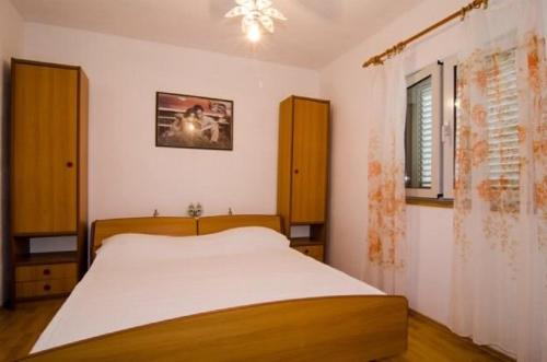 Postel nebo postele na pokoji v ubytování Apartments Dalibor