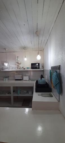 a kitchen with a counter with two lights on it at Cozy Guest in Graskop