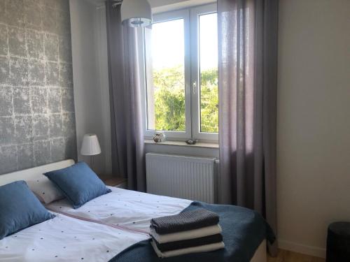 Postel nebo postele na pokoji v ubytování Morze Wrzosów