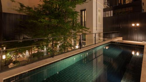 a swimming pool on top of a building at Hotel Valverde Lisboa - Relais & Chateaux in Lisbon