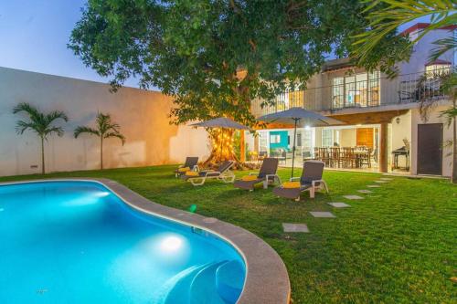 a swimming pool in the yard of a house at Casa Ines Alberca Privada in Puerto Vallarta