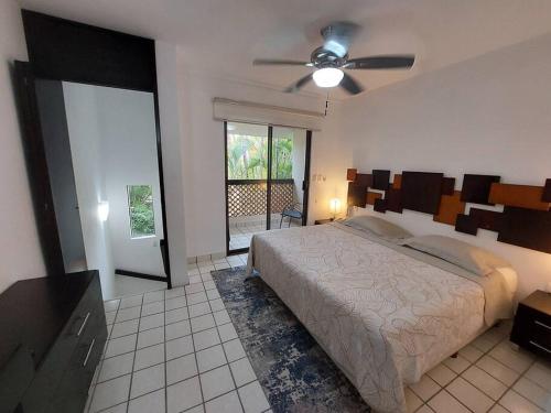 Postel nebo postele na pokoji v ubytování Villas Cozumel #8