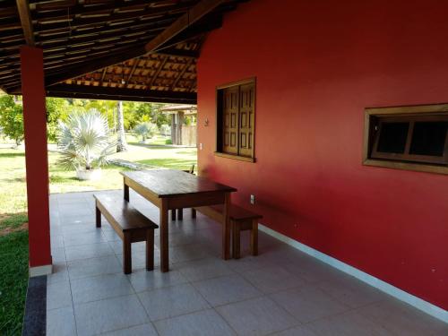 a table and bench sitting on a patio at Pousada Pratigi in Ituberá