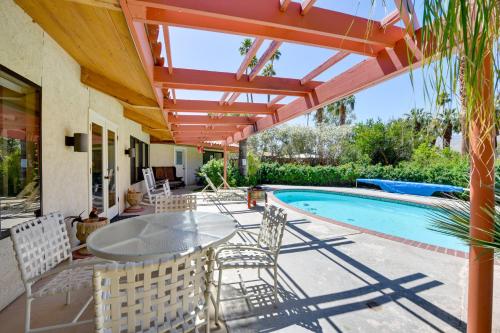 a patio with a table and chairs and a swimming pool at Borrego Springs Getaway with Private Pool and Views! in Borrego Springs