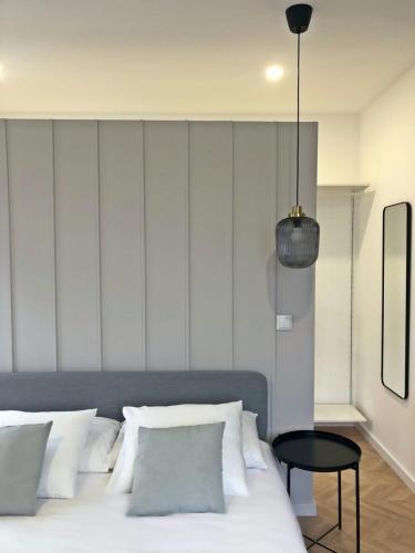 Postel nebo postele na pokoji v ubytování Charme do Largo - Apartment