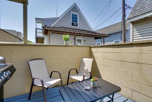 two chairs and a table on a patio at Seaside Heights Condo with Deck Walk to Boardwalk! in Seaside Heights