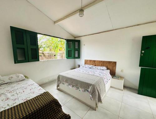 Säng eller sängar i ett rum på Pousada Vila Matury