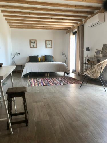 Ένα ή περισσότερα κρεβάτια σε δωμάτιο στο La Casa Del Racou