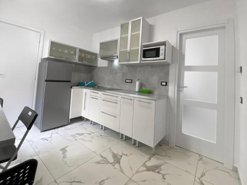 Kuchyň nebo kuchyňský kout v ubytování Accogliente appartamento