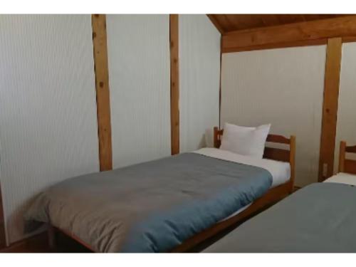 a bedroom with two twin beds in it at Karuizawa Sunny Village - Vacation STAY 57957v in Karuizawa