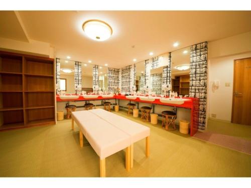 a large dressing room with a white table and chairs at Yuzennoyado Toukai - Vacation STAY 57658v in Ureshino