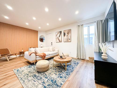 a living room with a couch and a table at Hollywood Habitat - BR11-WH in Los Angeles