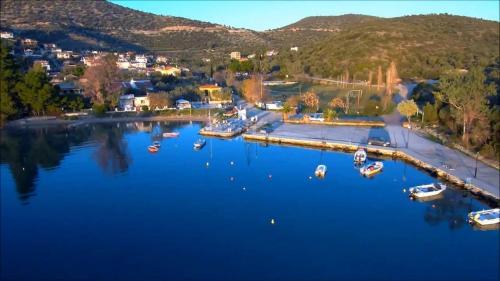 an aerial view of a harbor with boats in the water at Kritharia Guesthouse Volos in Kritharia