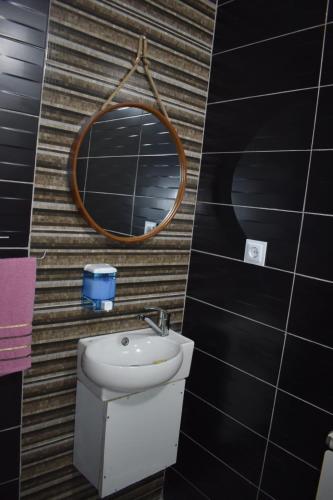 a bathroom with a sink and a mirror at Villa DIJA in Kruševo