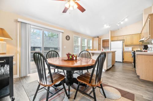 a kitchen with a dining room table and chairs at Wine Down - Beautiful and well-kept cabin with large fenced back yard in Big Bear City