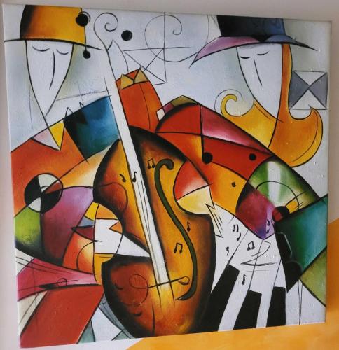 a painting of a group of cats with umbrellas at Hotel Plaza Inn in Figueres