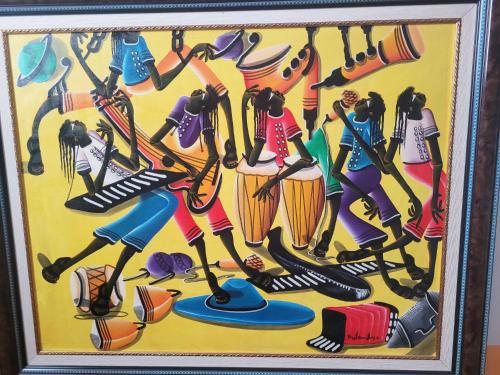 a painting of a group of girls playing baseball at Hotel Plaza Inn in Figueres