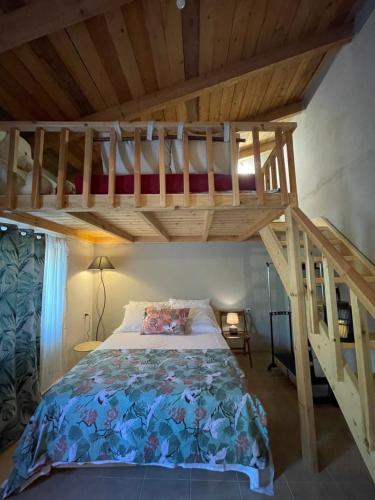 a bedroom with a bunk bed with a ladder at Loft for travellers in Vasilikí