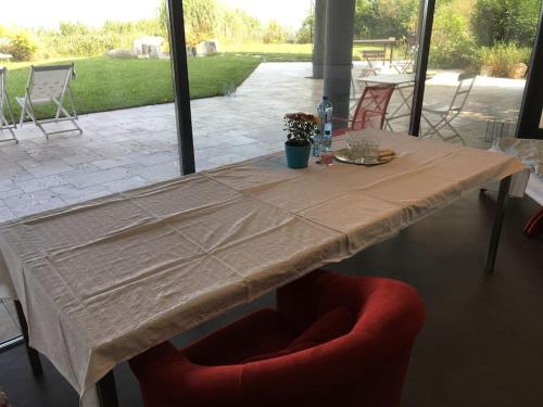 a table with a tan table cloth on it at Haus am Hügel in Oberkühberg