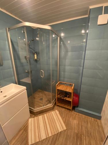 a bathroom with a shower and a sink at Rest in Palanga in Palanga