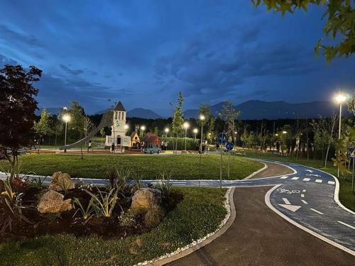 a winding road in front of a house at night at Dry lake apartment in Tirana