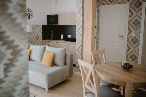 a living room with a couch and a table at Malinova 36 in Wisła