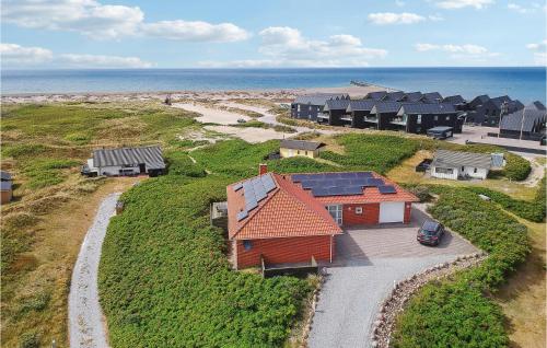 an aerial view of a group of houses on the beach at 4 Bedroom Stunning Home In Thisted in Thisted