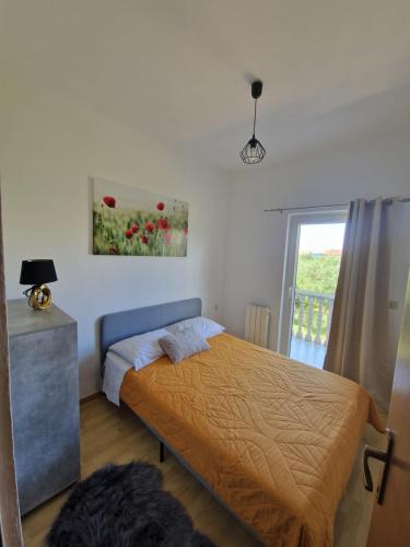 Postel nebo postele na pokoji v ubytování Apartmani Tereza