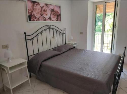 מיטה או מיטות בחדר ב-Casa vacanze Alloro