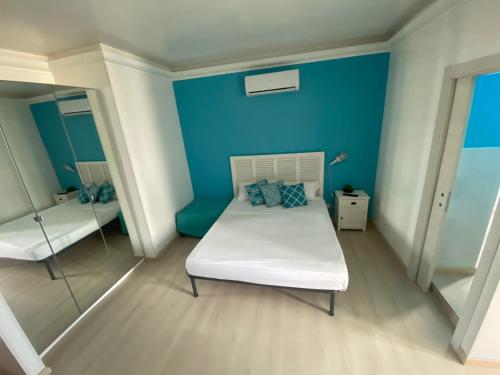 Ein Bett oder Betten in einem Zimmer der Unterkunft La perla nera