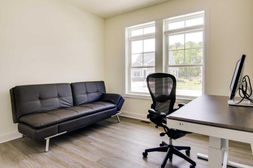 a living room with a leather couch and a desk at Ocean View Home with Kayaks about 2 Mi to Bethany Beach in Ocean View