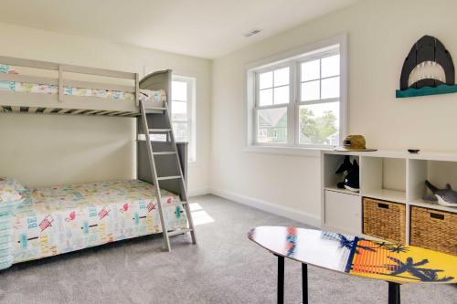 a bedroom with bunk beds and a surfboard at Ocean View Home with Kayaks about 2 Mi to Bethany Beach in Ocean View