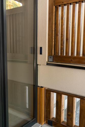 a sliding glass door with a window in a room at Apartman Aleni - Bela Reka, Brzeće in Brzeće