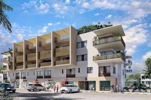 a rendering of a building with cars parked in a parking lot at Live! Departamento céntrico con asombroso Rooftop y Alberca in Cabo San Lucas
